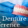 hands holding dentures